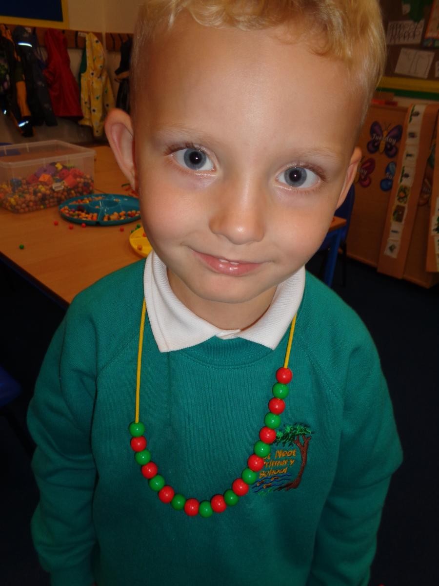 A great repeating pattern on George's necklace.