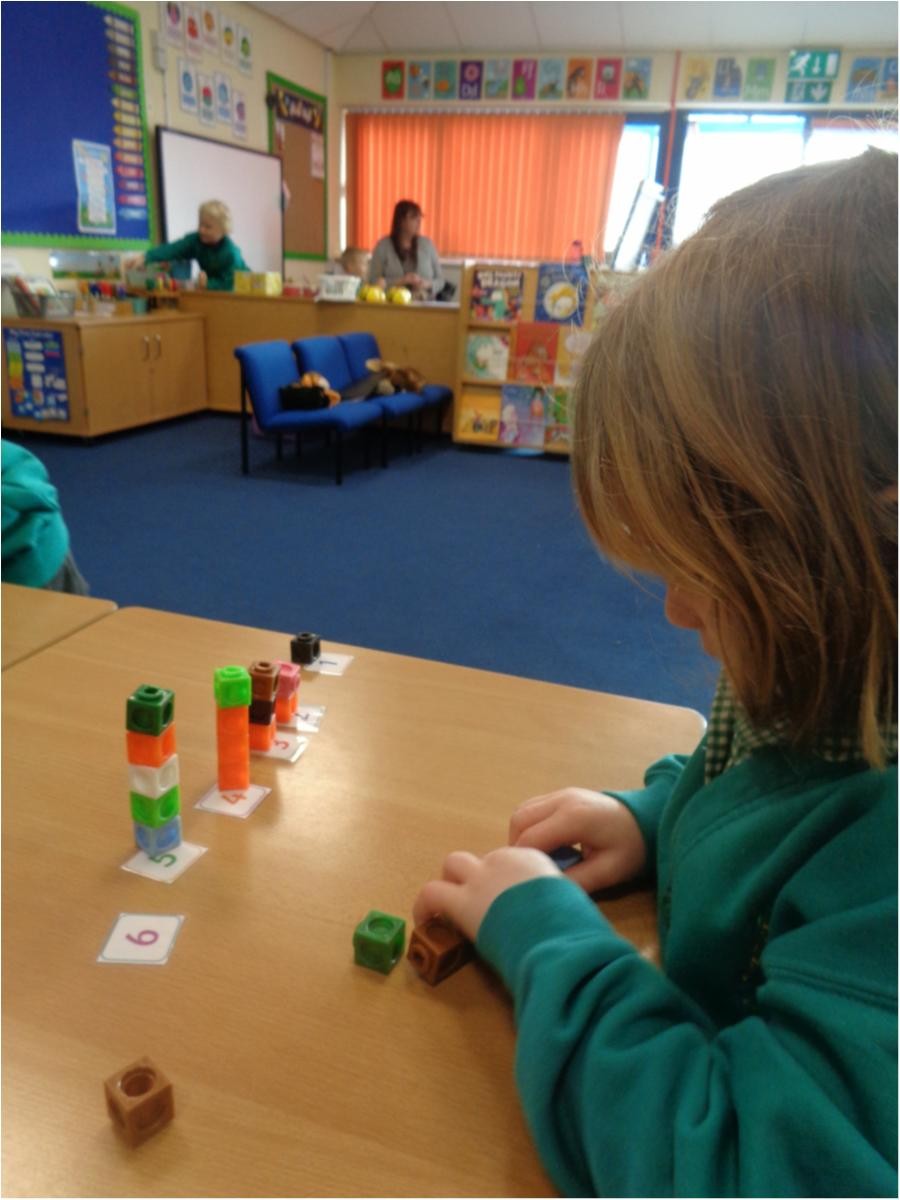 Making towers to match the numbers.