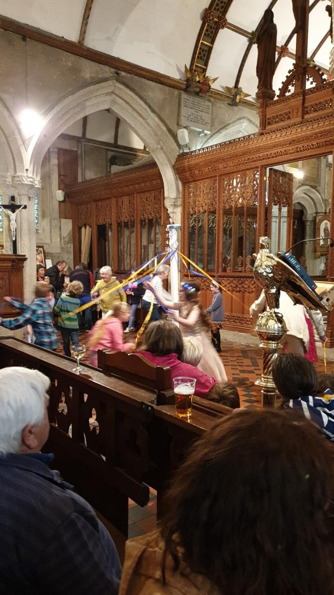 Maypole dancing in St Neot Church for Oak Apple Day.