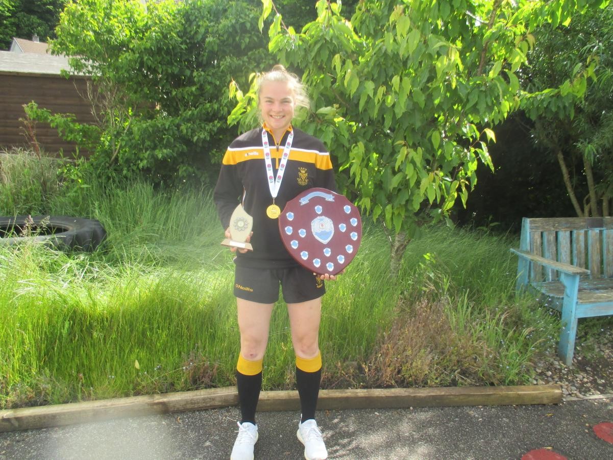 We found the shield that Amy won with the school when she was a pupils. 