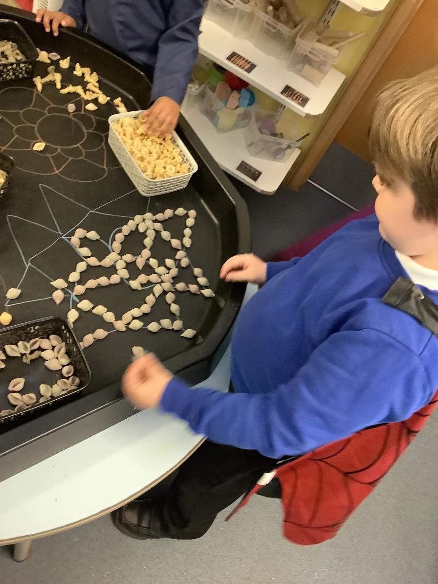 Rangoli patterns with pasta 