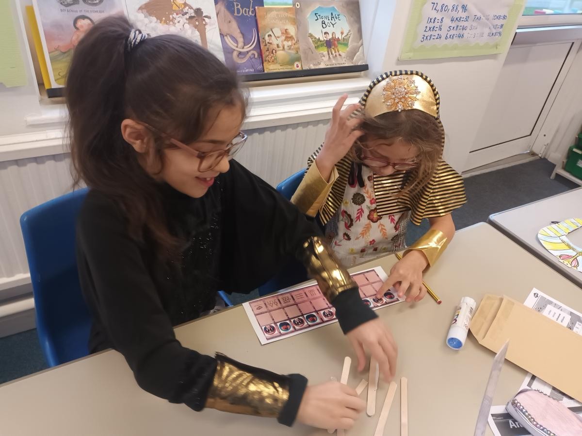 We played Senet, an Ancient Egyptian board game
