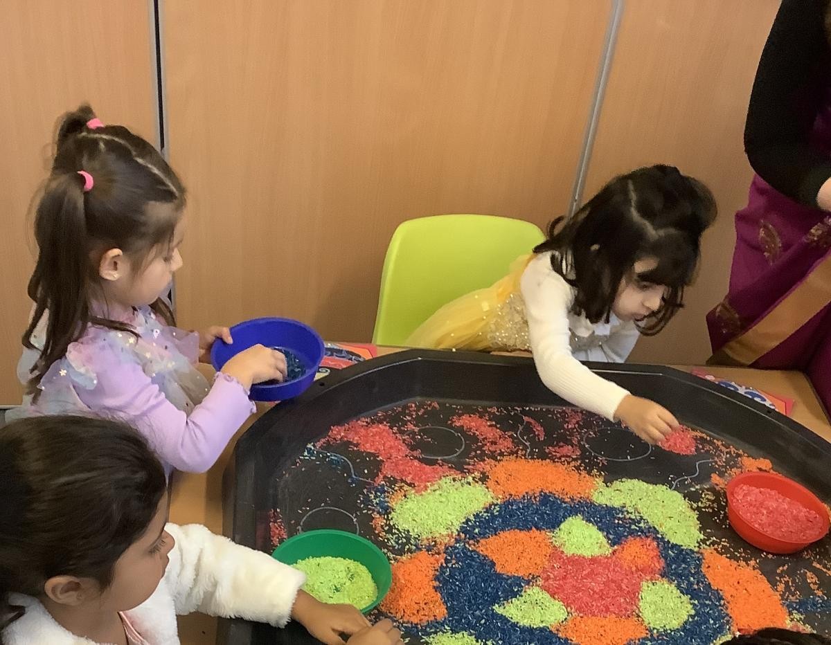 Rangoli patterns with coloured rice 