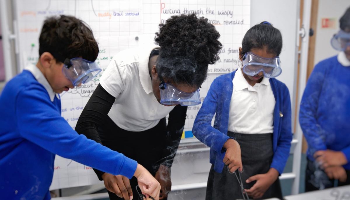 Children engaged in an activity wearing safety goggles