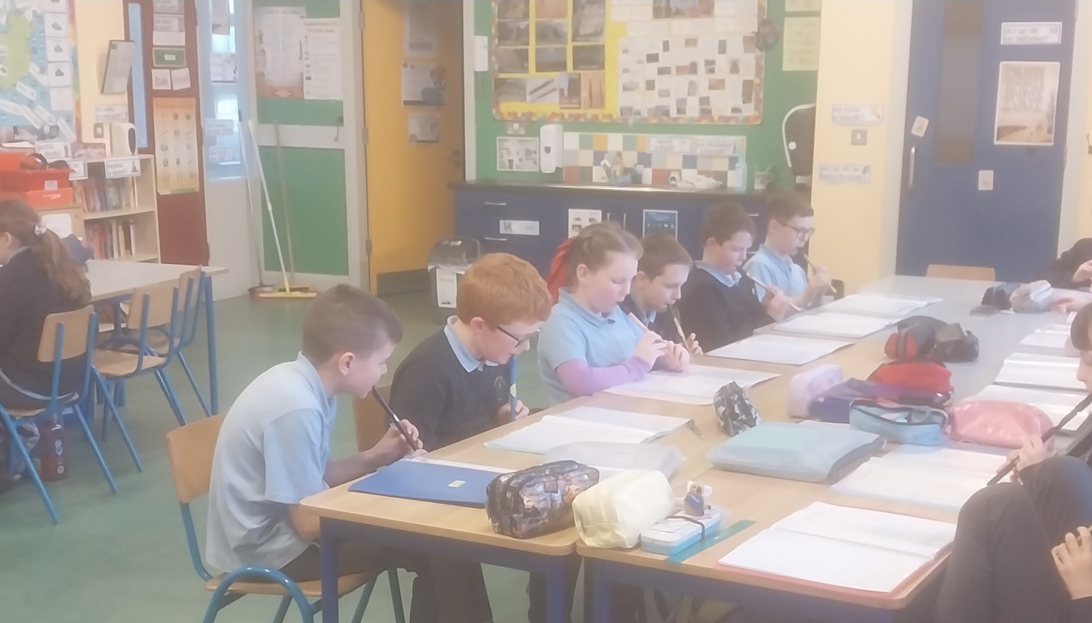 Learning to play the tin whistle.