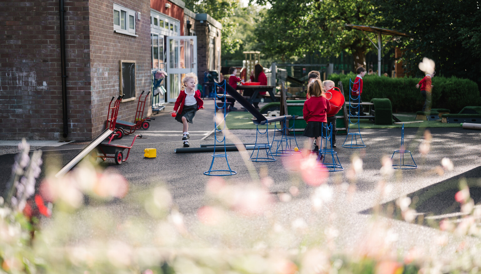 Children playing in the EYFS outdoor area