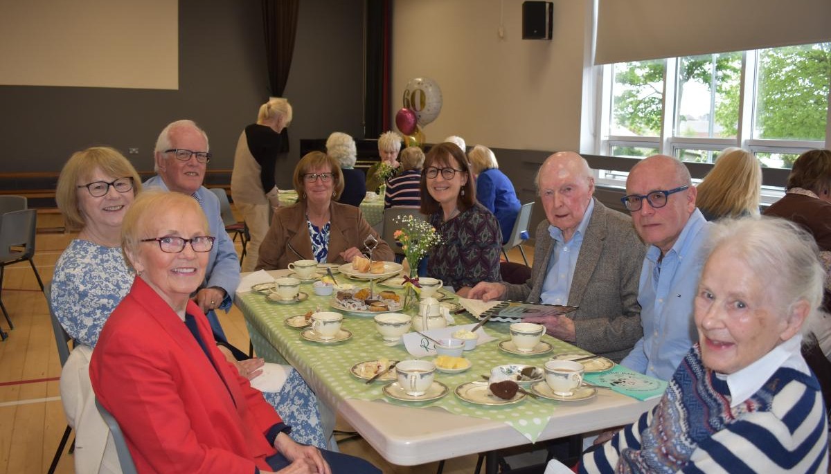 Group of people sat around a table 