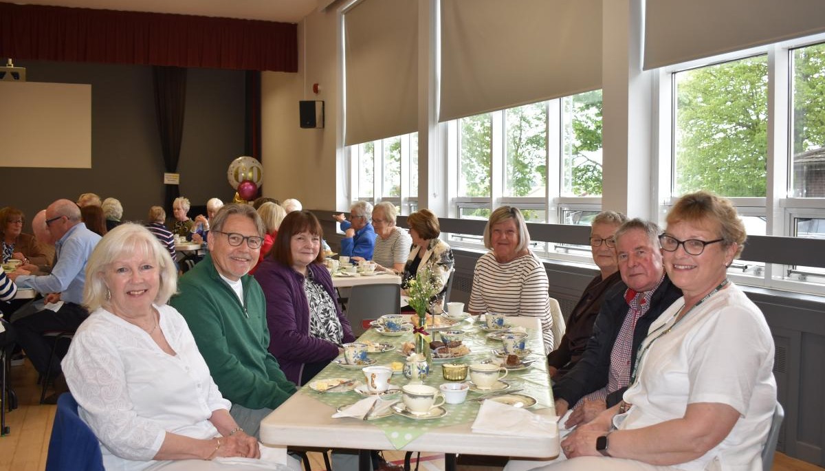 Group of people sat around a table 