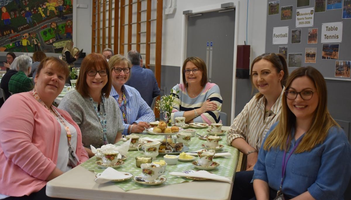 Group of people sat around a table 