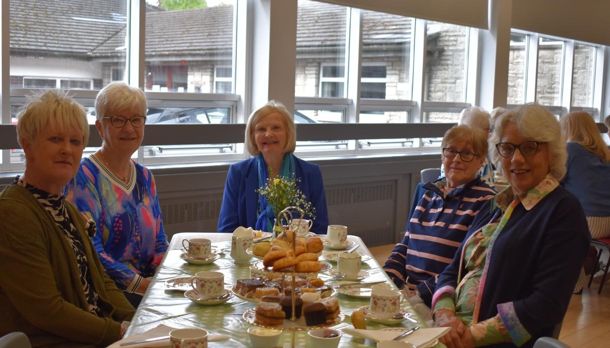 Group of people sat around a table 
