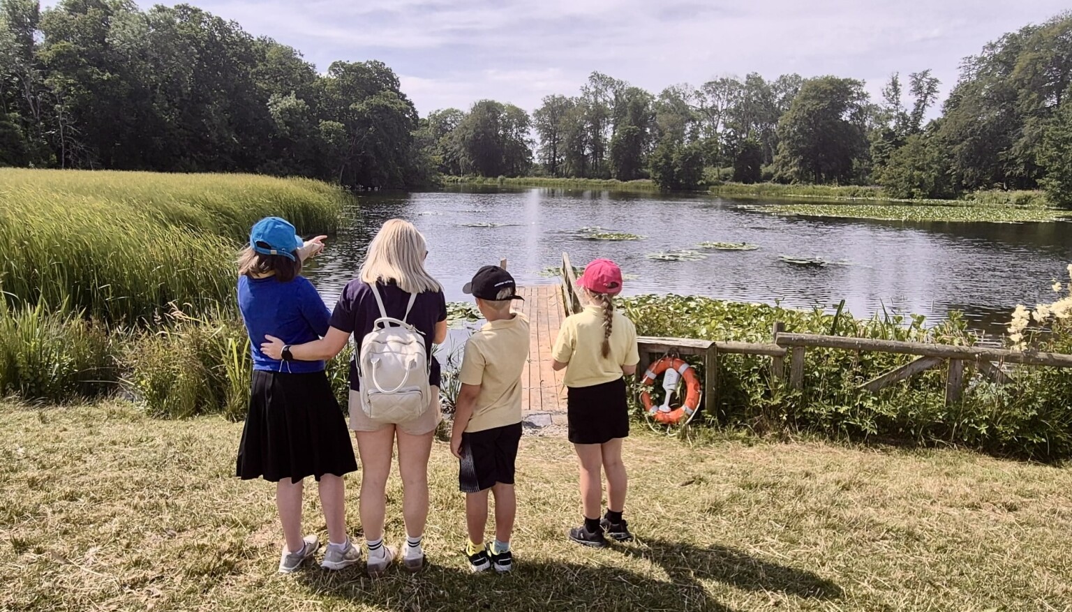 Pupils stood by a lake at Berrington Hall
