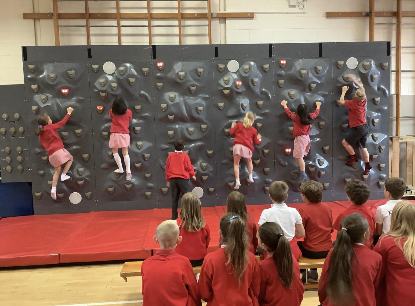 Pupils on a climbing wall