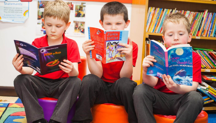 Pupils reading in a library
