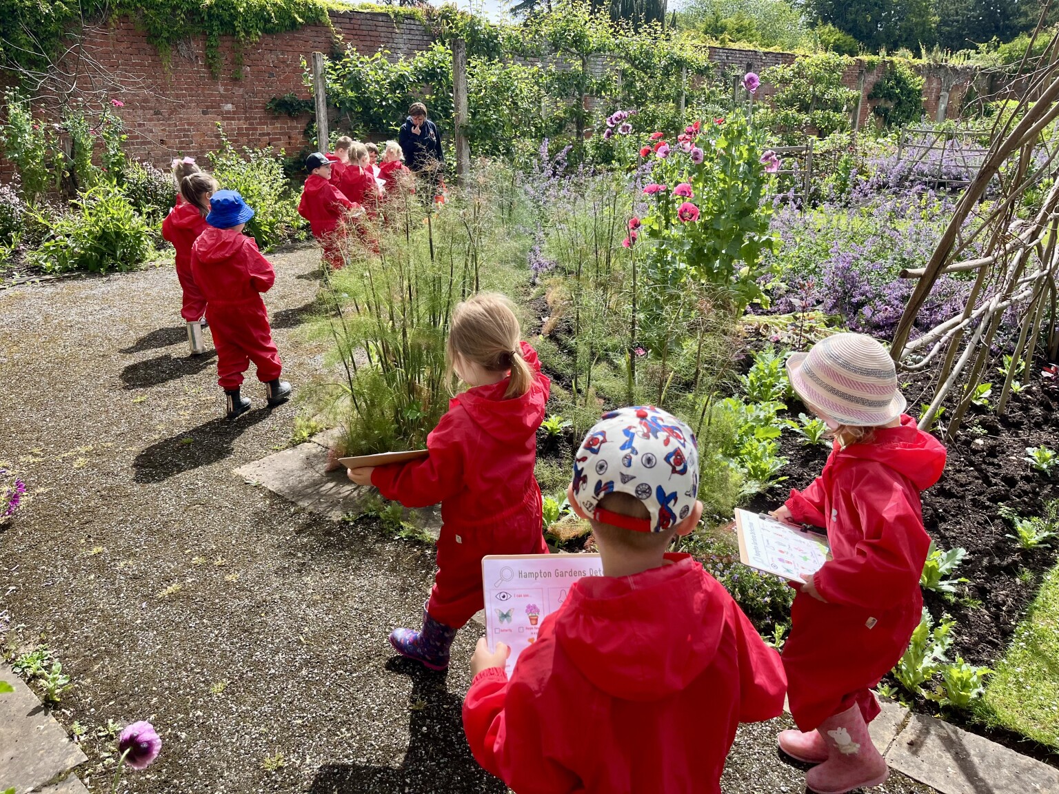Children visiting a flower garden