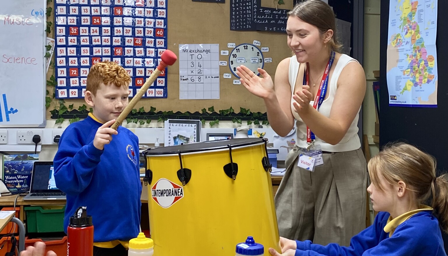 Pupil hitting a drum