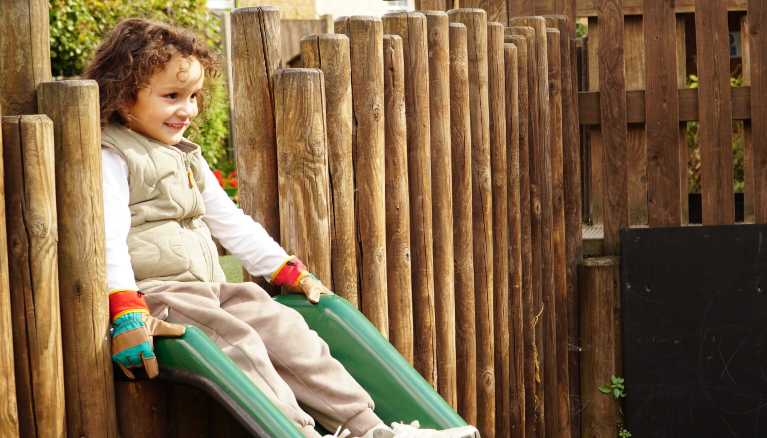 The children love coming down the slide at nursery.