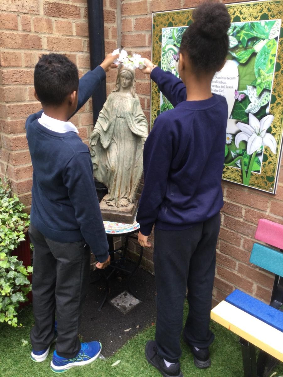 Crowning of Our Lady in the prayer garden. 