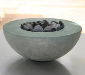 21 cm dia x 10 cm high. Cement, seaglass and green pebbles. Carol Sinclair £350.