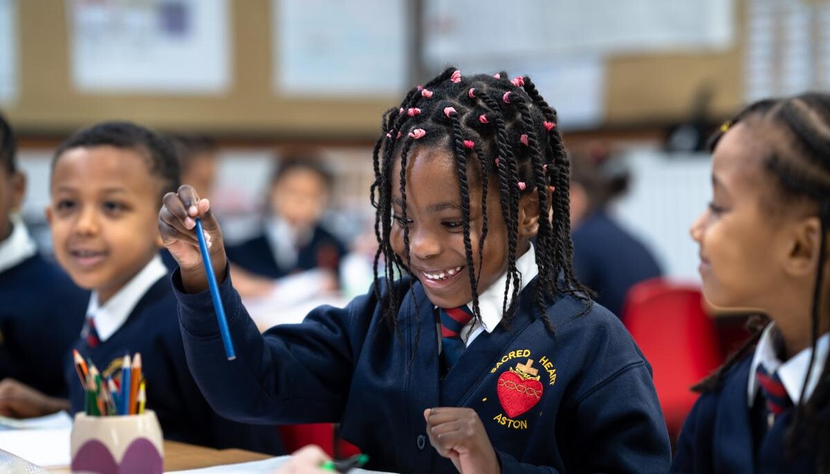 Smiling pupils in class