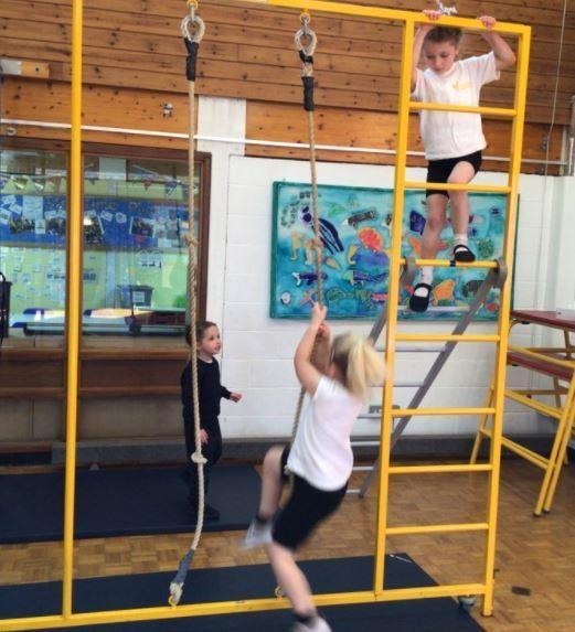 Child using climbing equipment