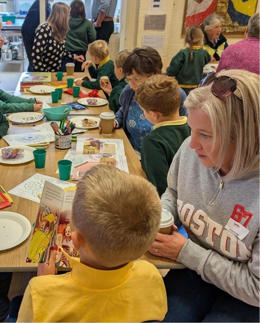 Adults and children enjoying drinks and snacks
