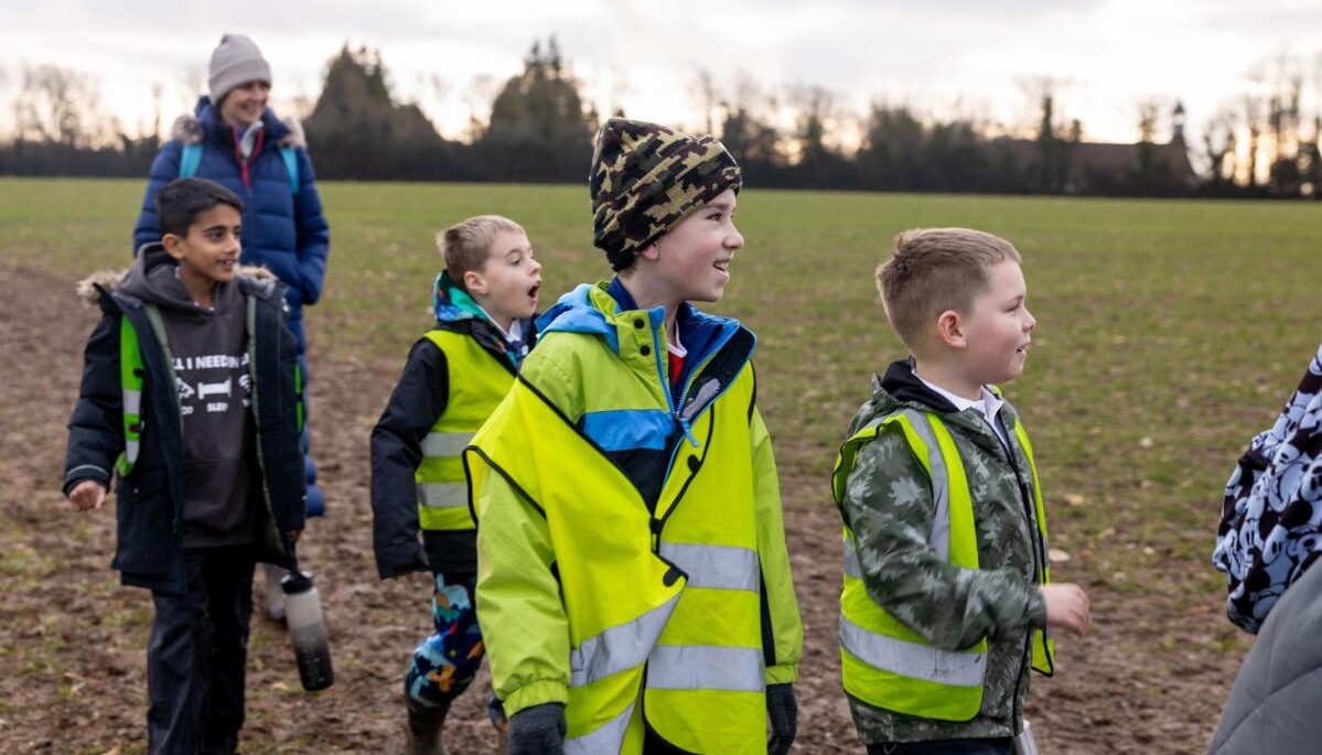 Smiling pupils in a field