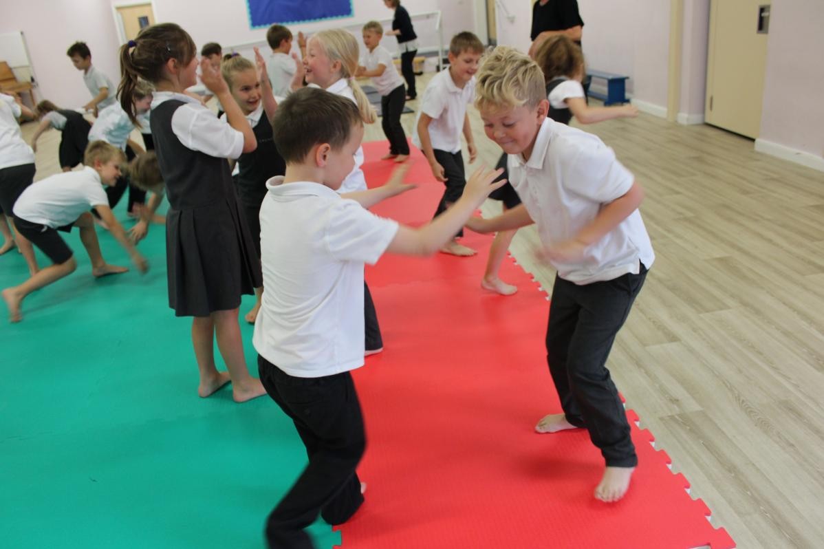 Children playing in school hall