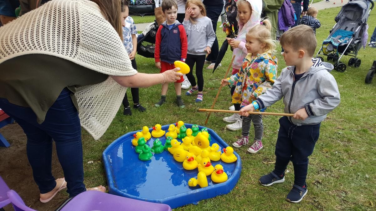 Child playing hook a duck