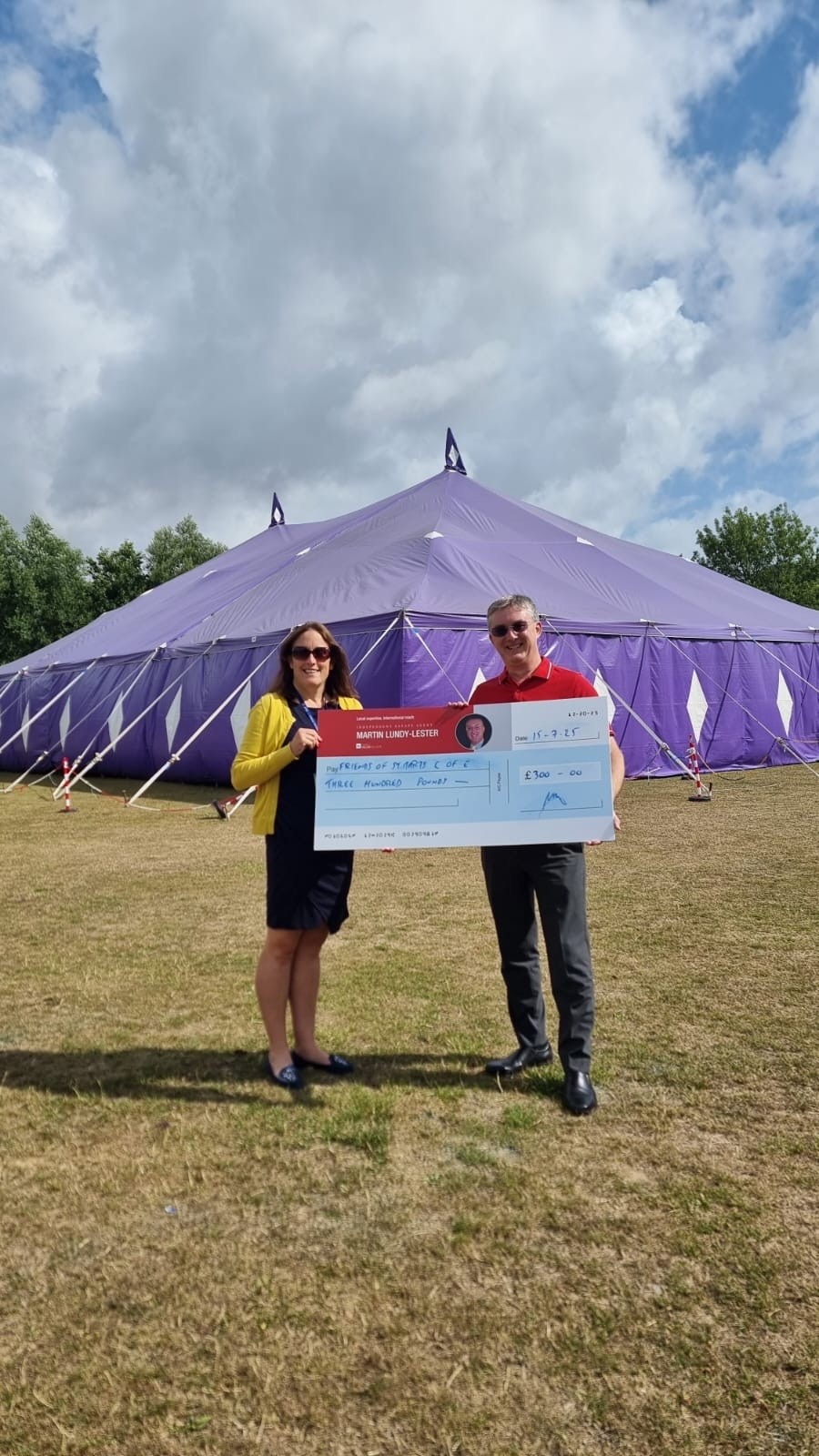 Martin Lundy-Lester presents the cheque to Mrs Copus...