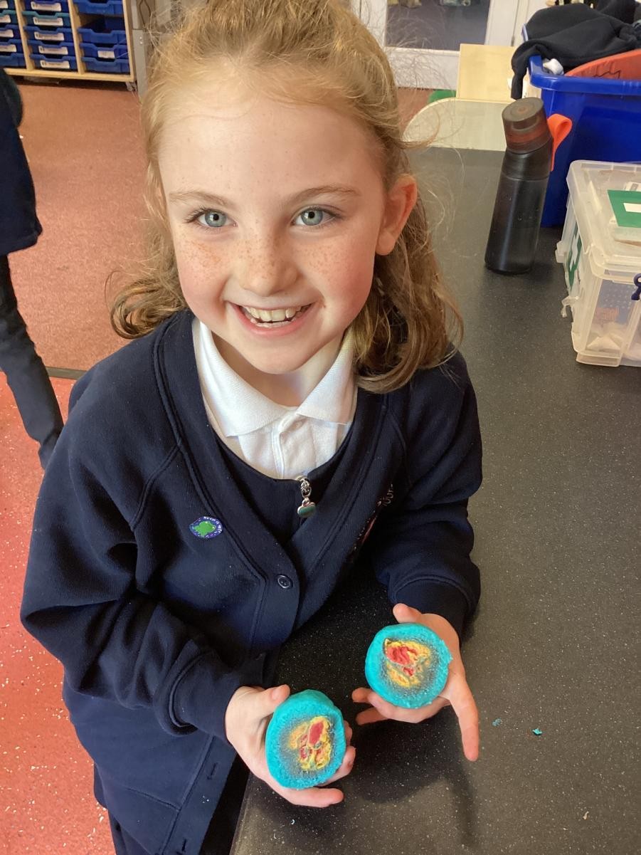 Child holding stones