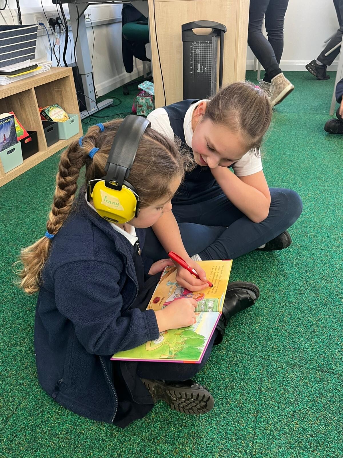 Reading buddies - sharing books and engaging in story language