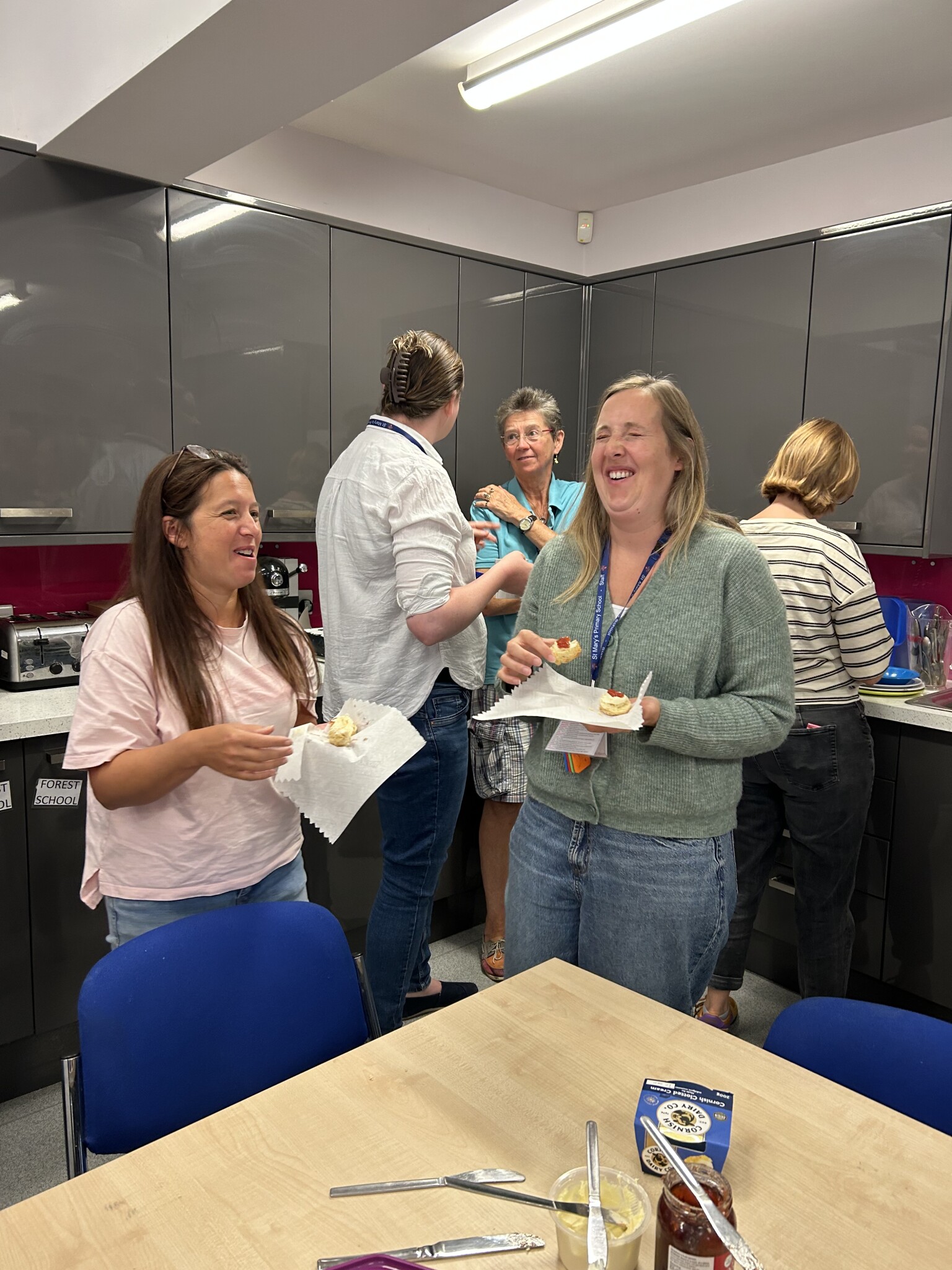 Staff sharing scones on our INSET Day