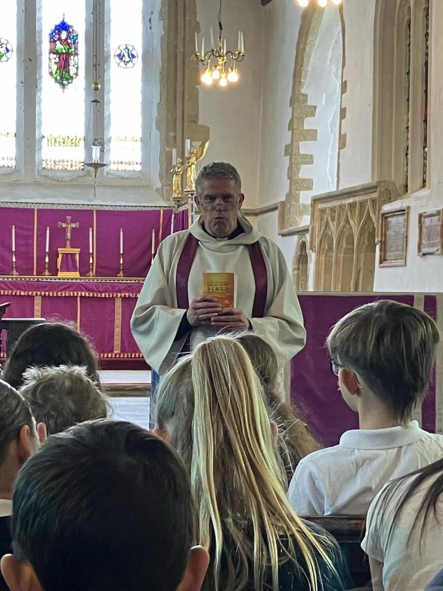 Fr Paul leads class worship in the church