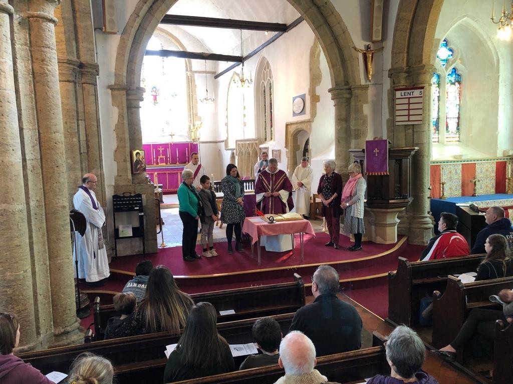 Archdeacon Luke signs the covenant for 'Growing Partnerships'