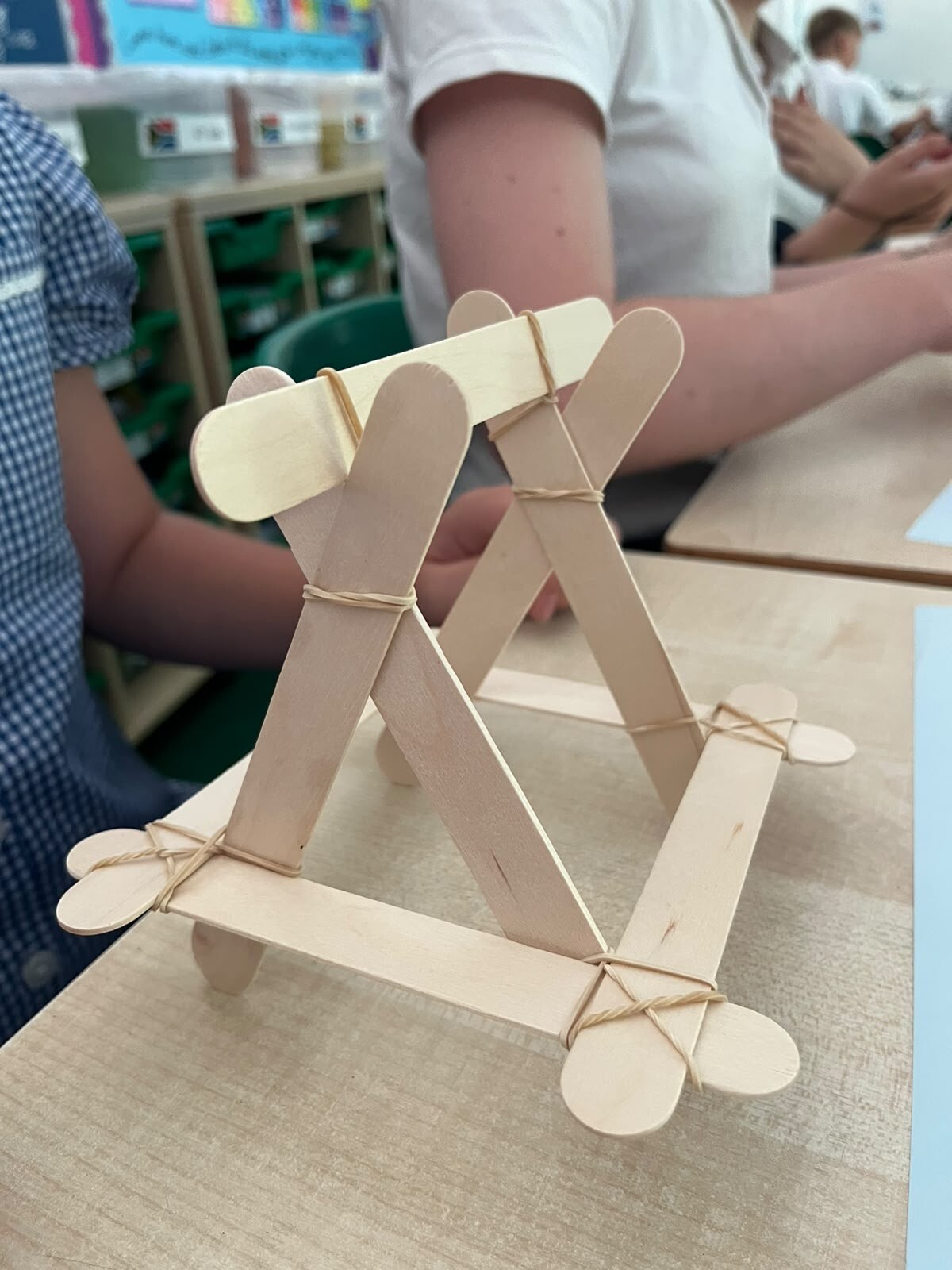 Visiting STEM scientist making catapults