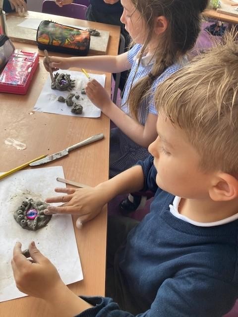 Yr 2 - dinosaur eyes...sculpting