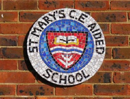 Our School Badge mosaic made by the children