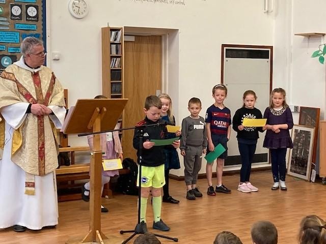 Easter Eucharist - the children reading their prayers which talked about Ukraine  showing their awareness of world issues. 