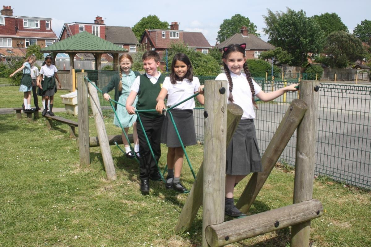 Children climbing on trim trail