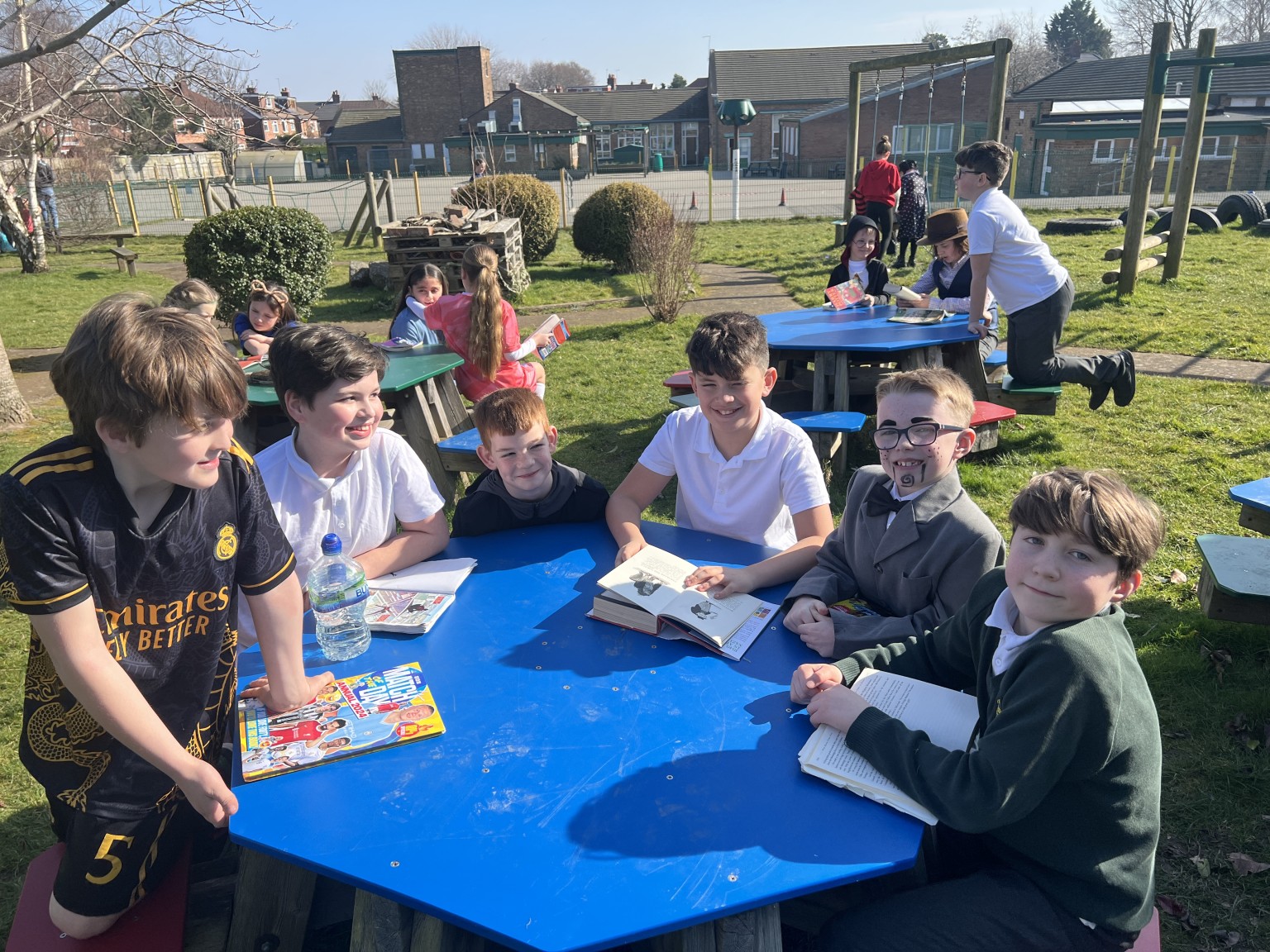 Year 6s and Year 3s reading to eachother 