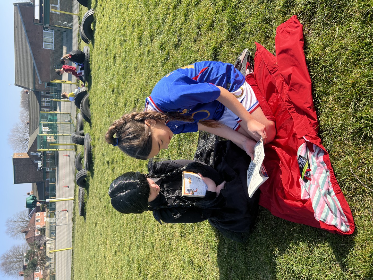Year 6s and Year 3s reading to eachother 