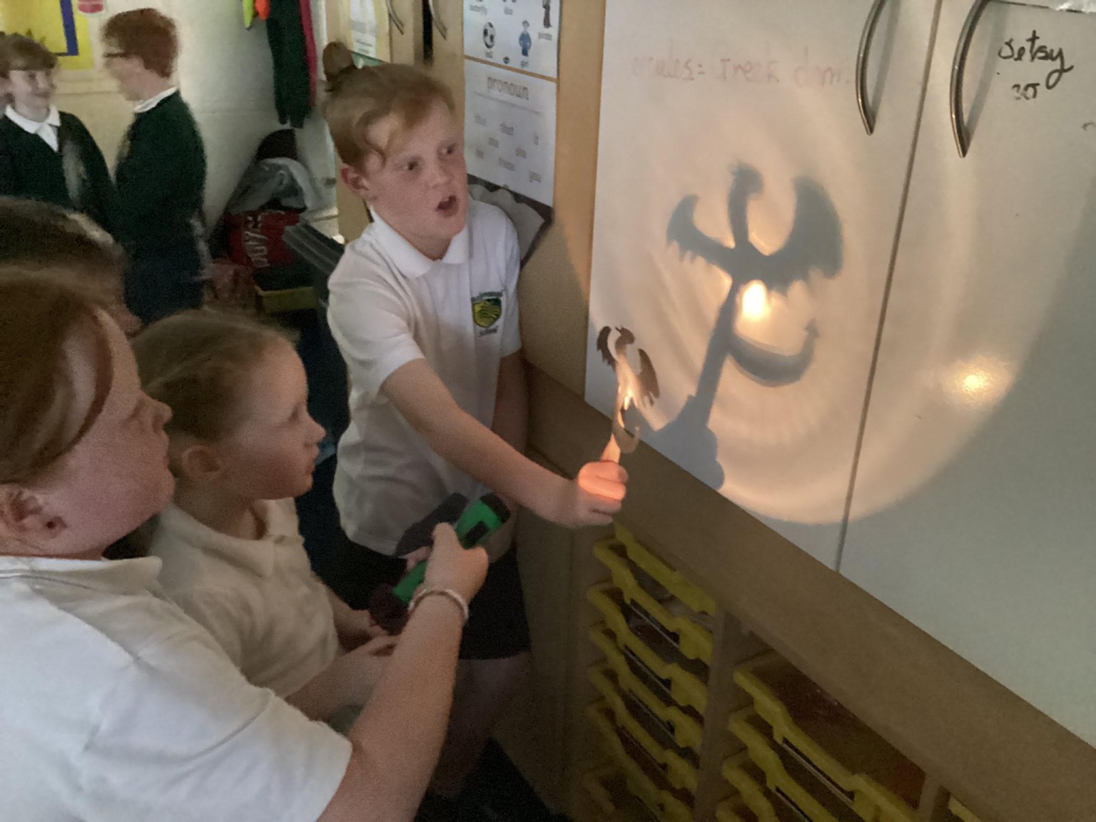upils making their own shadow puppets to discover if they could make them bigger or smaller.