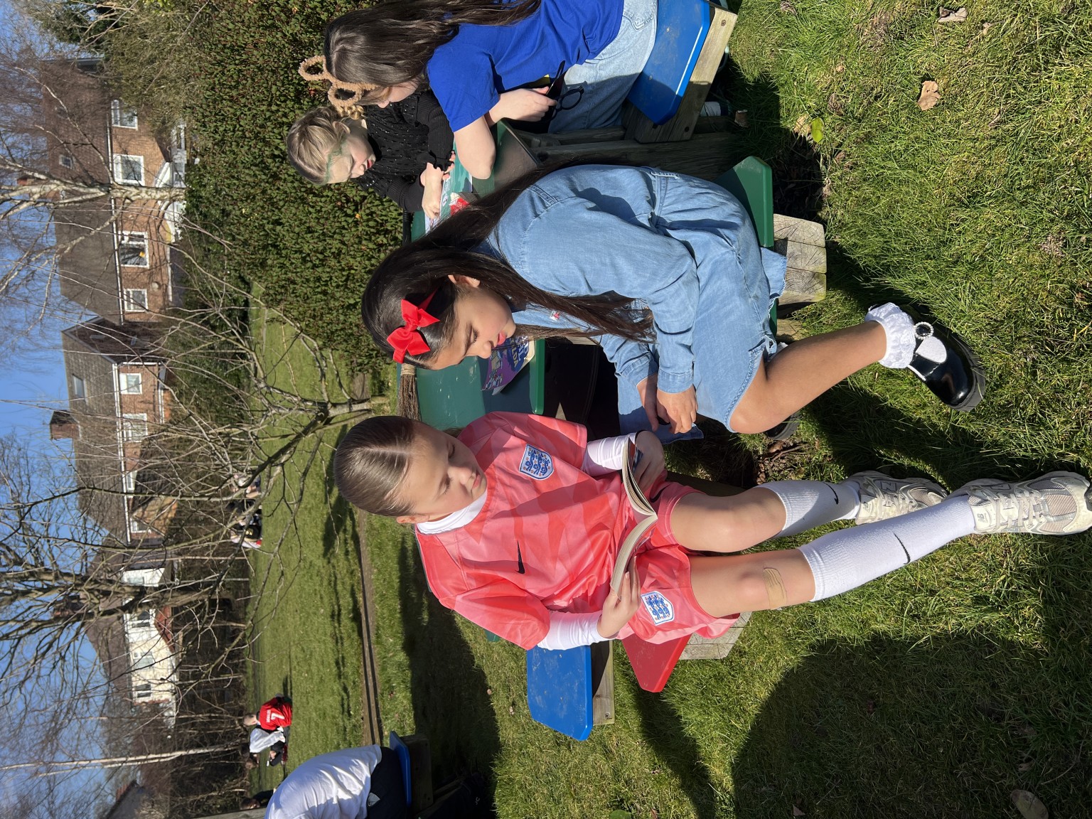 Year 6s and Year 3s reading to eachother 