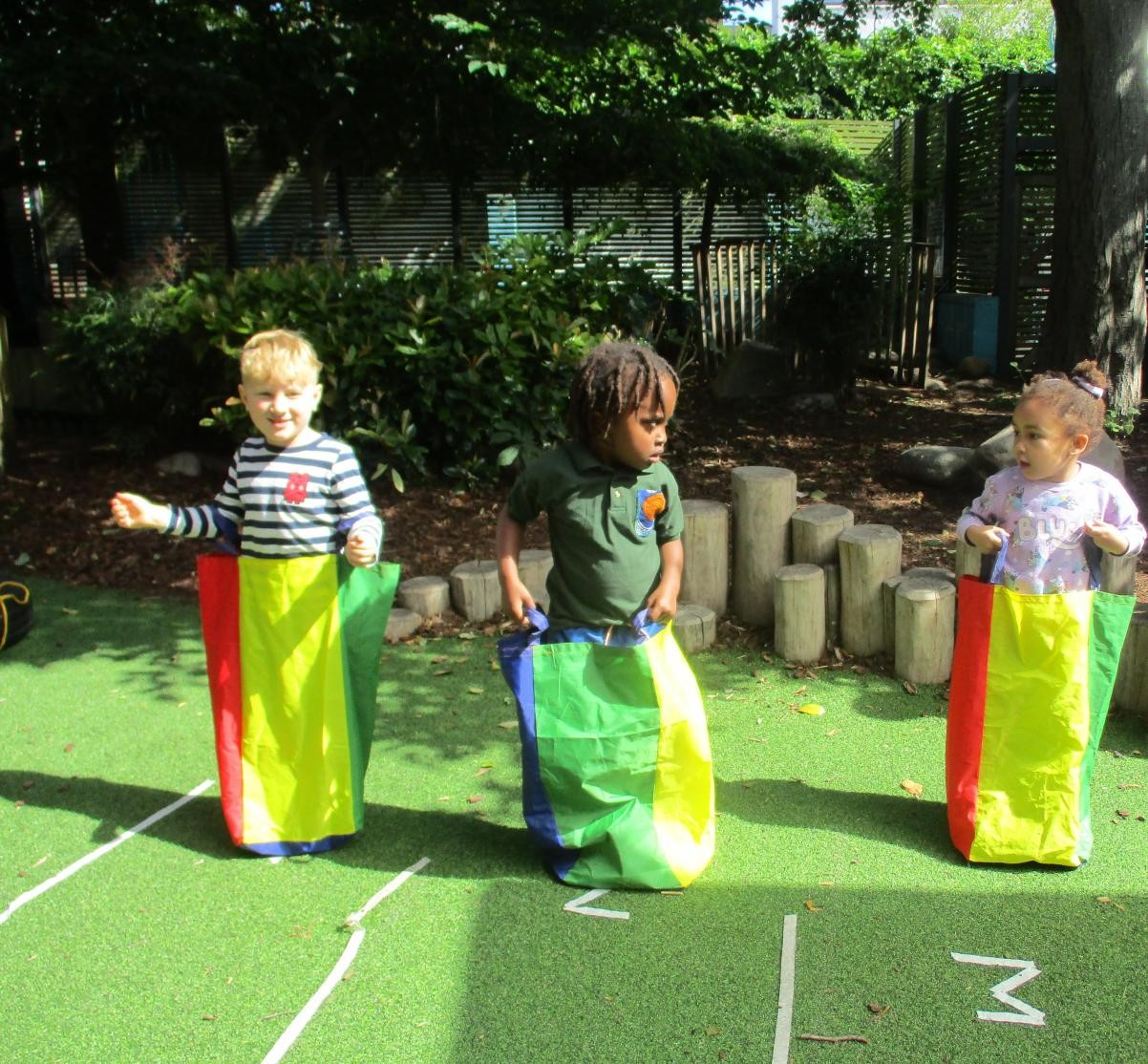 children taking part in a sack race