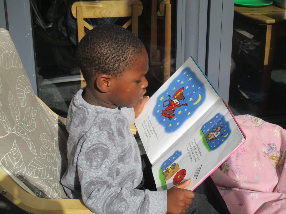 Child reading a book 