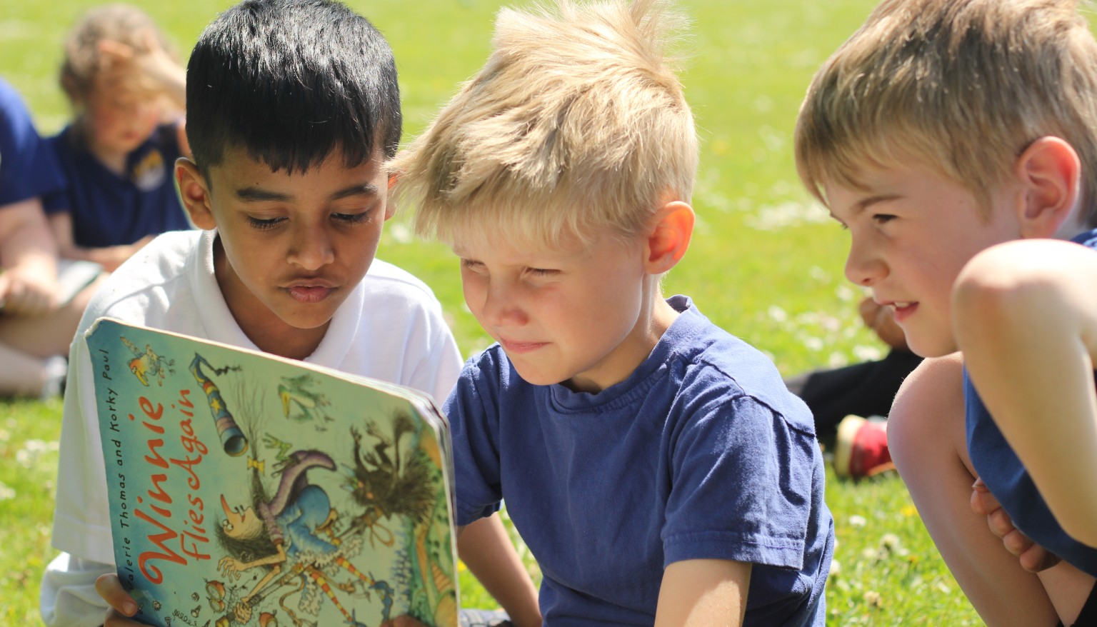 Children enjoy reading daily - especially when the weather is nice enough to read outdoors