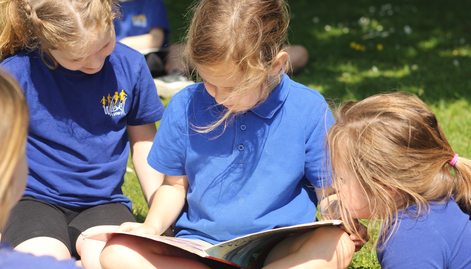 Children enjoy reading daily - especially when the weather is nice enough to read outdoors