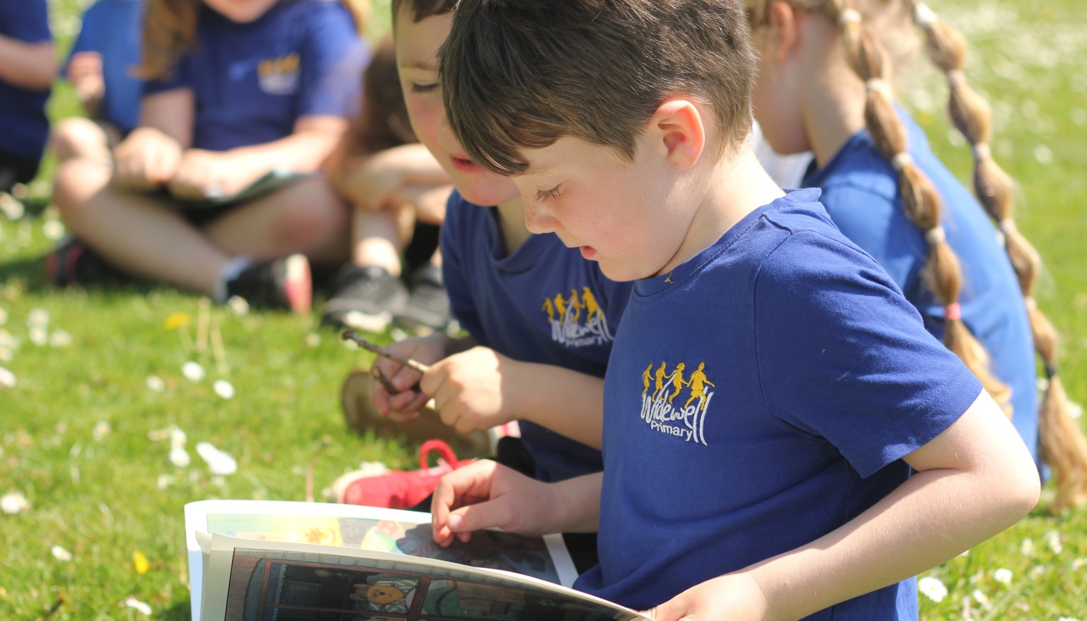 Children enjoy reading daily - especially when the weather is nice enough to read outdoors