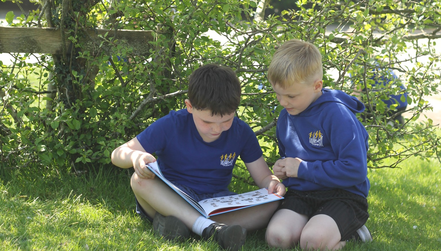 Children enjoy reading daily - especially when the weather is nice enough to read outdoors