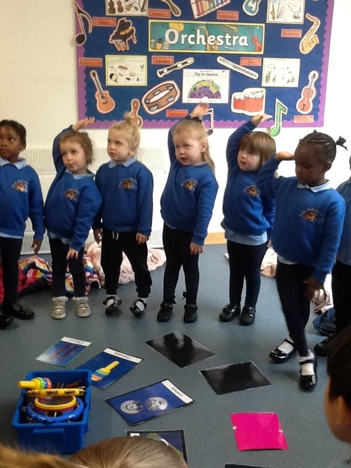 Nursery having fun learning about different instruments